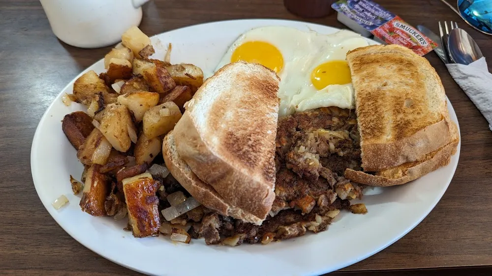 Roast Beef Hash with Eggs Sunnyside Up Home Fries and Homemade Bread